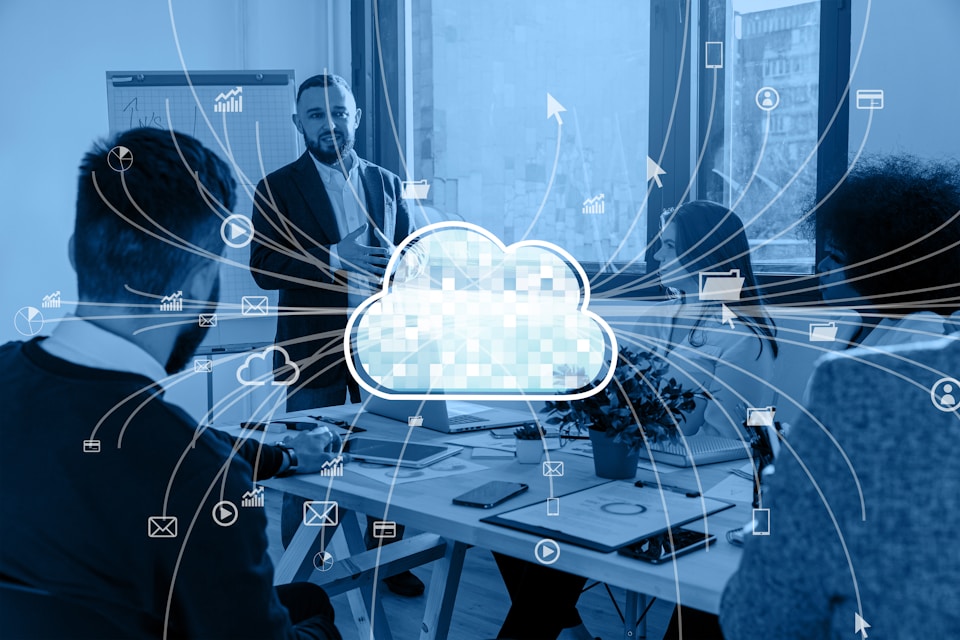 a group of people sitting around a table with a cloud above them